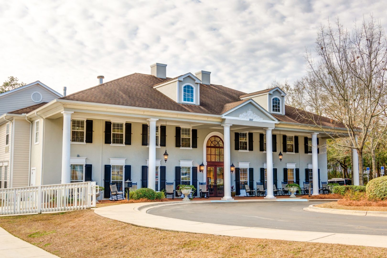 a large building with a circular driveway