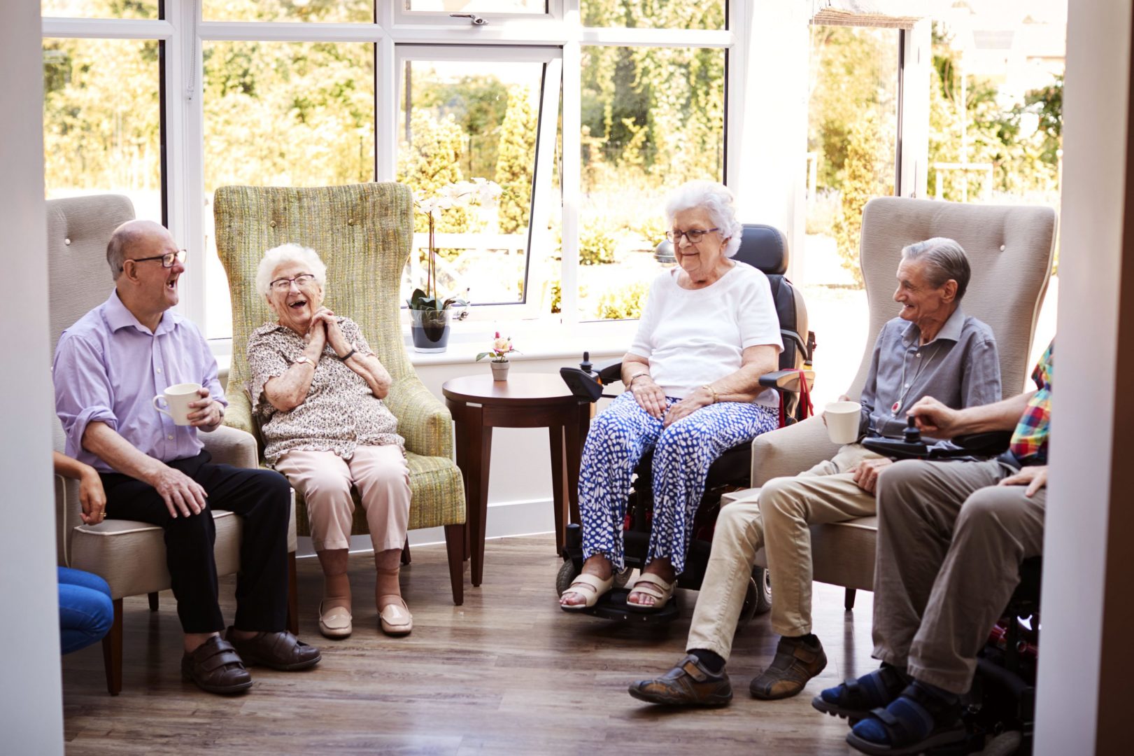 a group of old people sitting in chairs