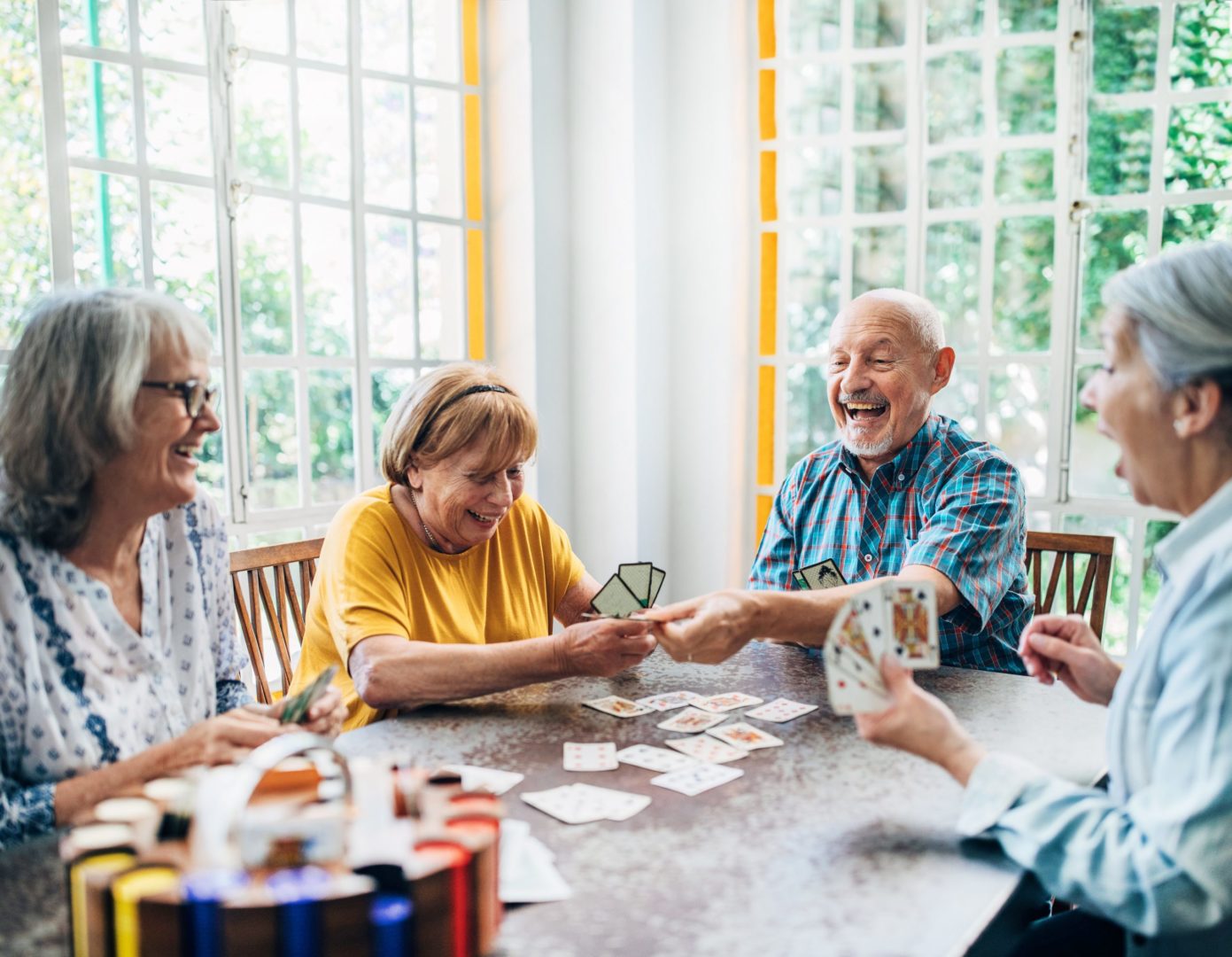 a group of people playing cards