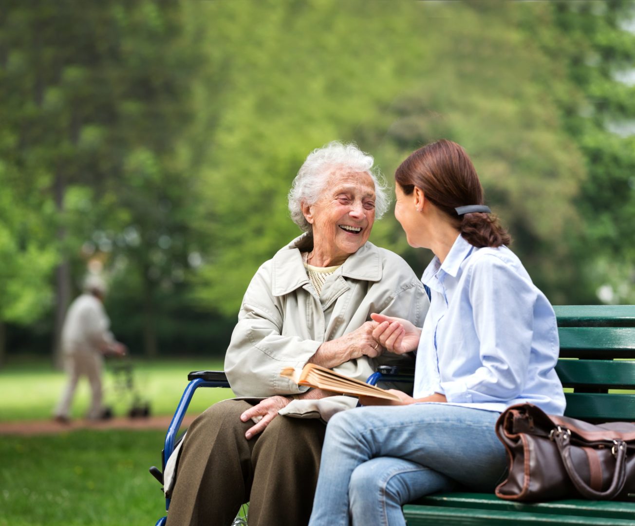 a person and a young person sitting on a bench