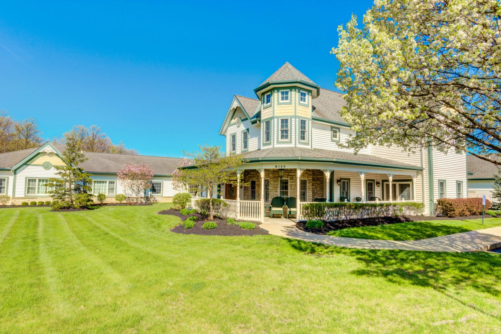 a house with a lawn and trees