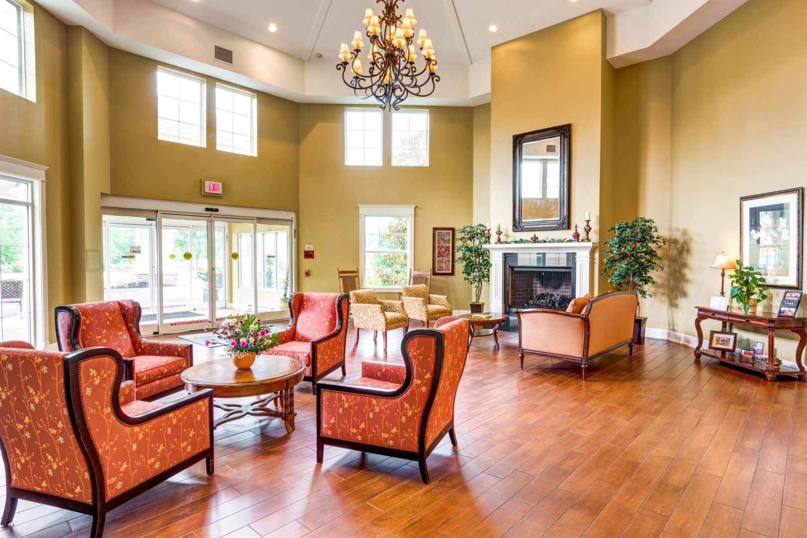 a room with chairs and a fireplace