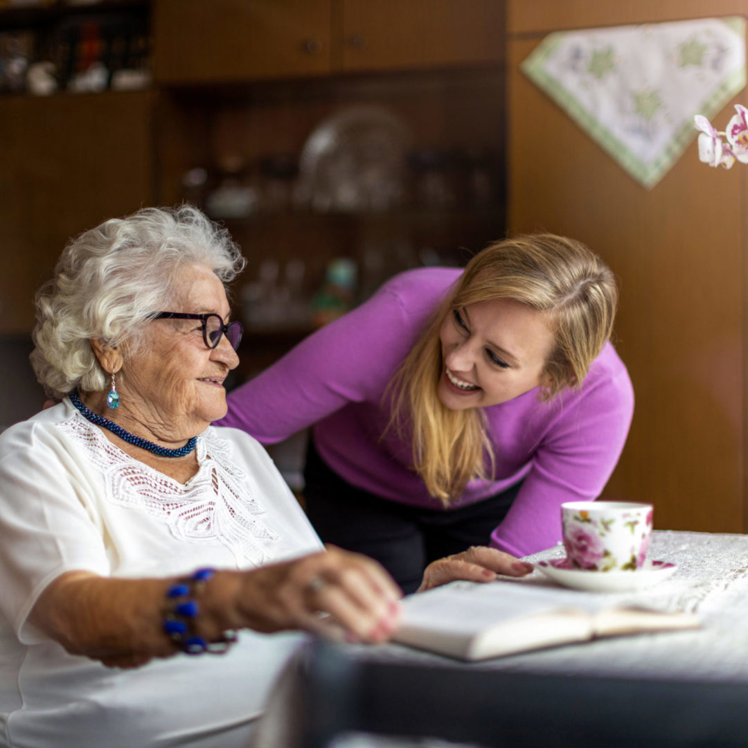 a person looking at an old person