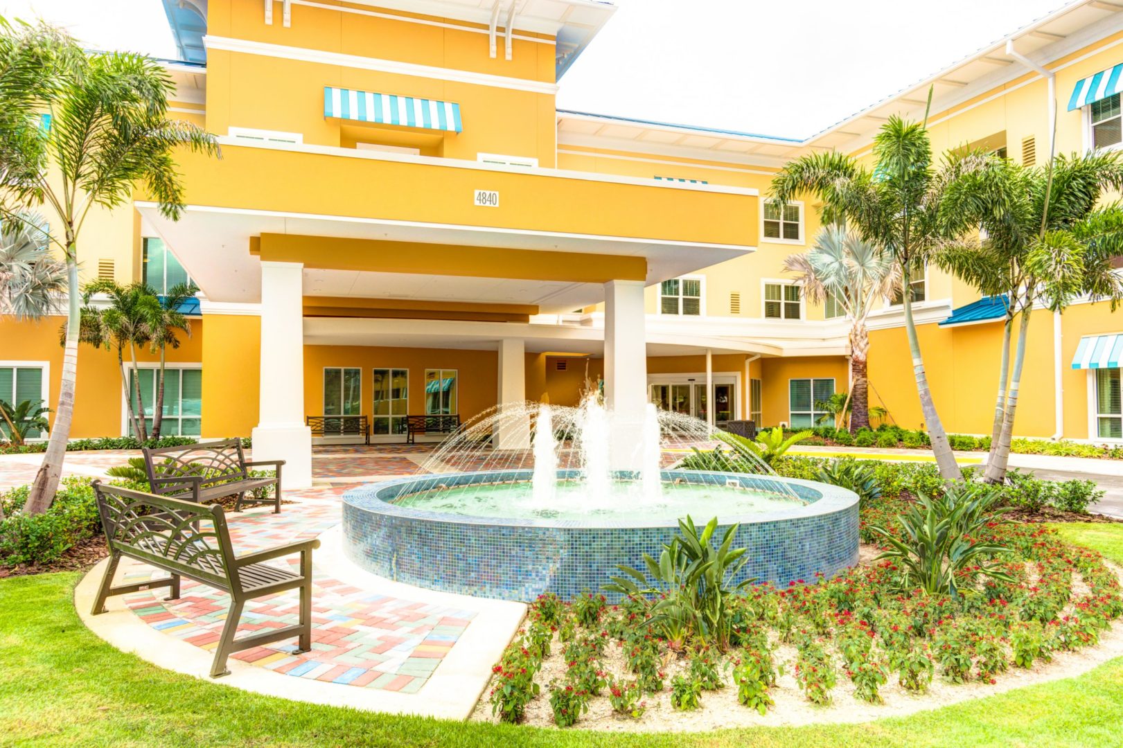 a water fountain in front of a building