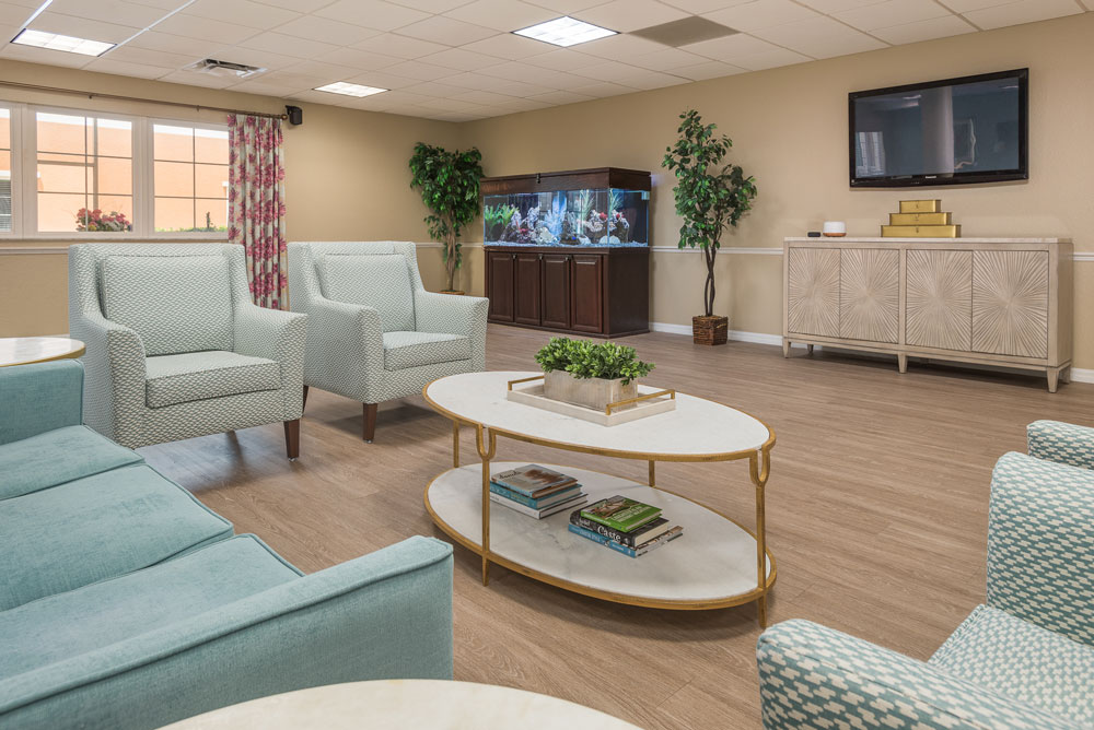 a room with a television and chairs