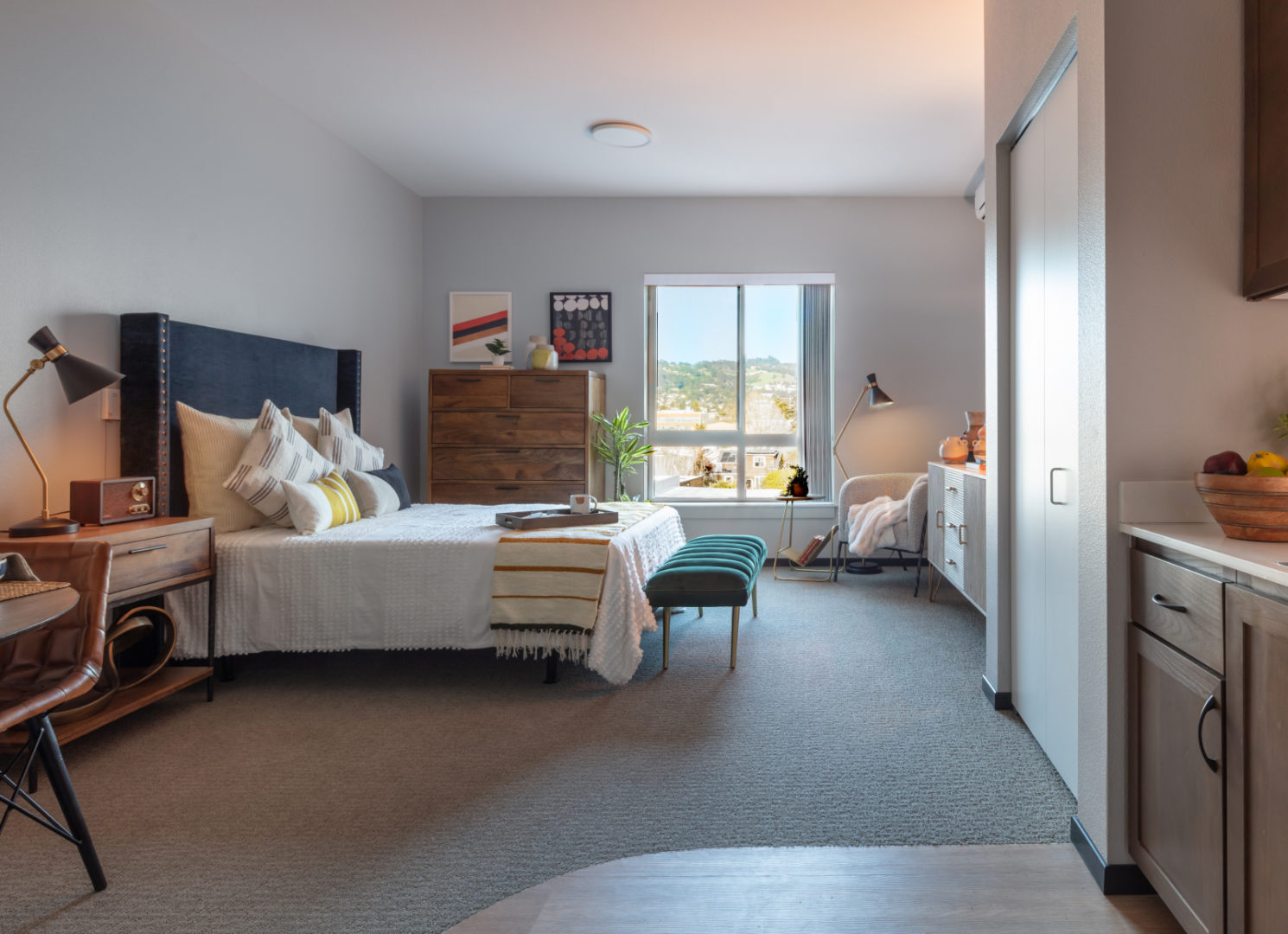 a bedroom with a bed and a dresser