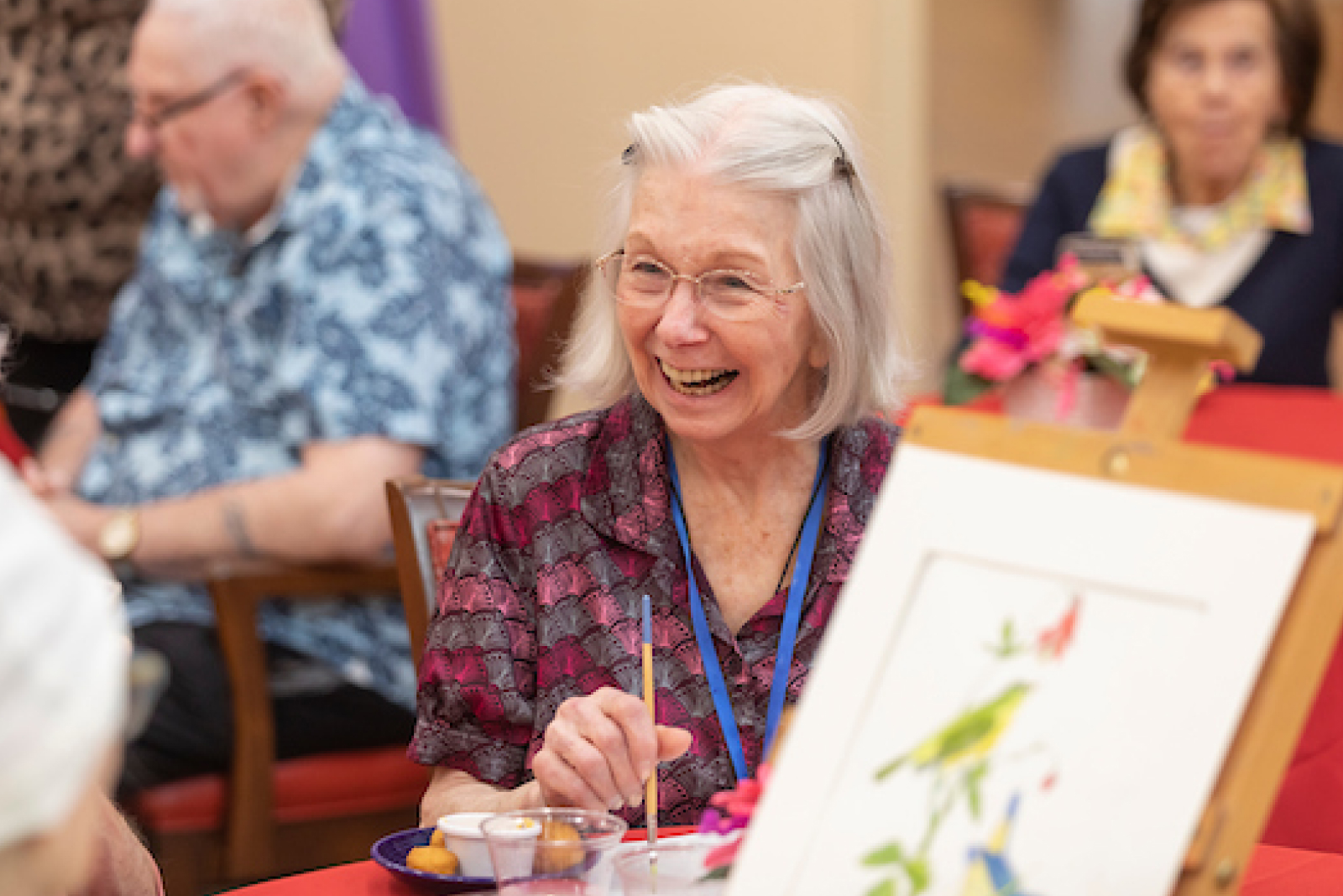 a person smiling at a table