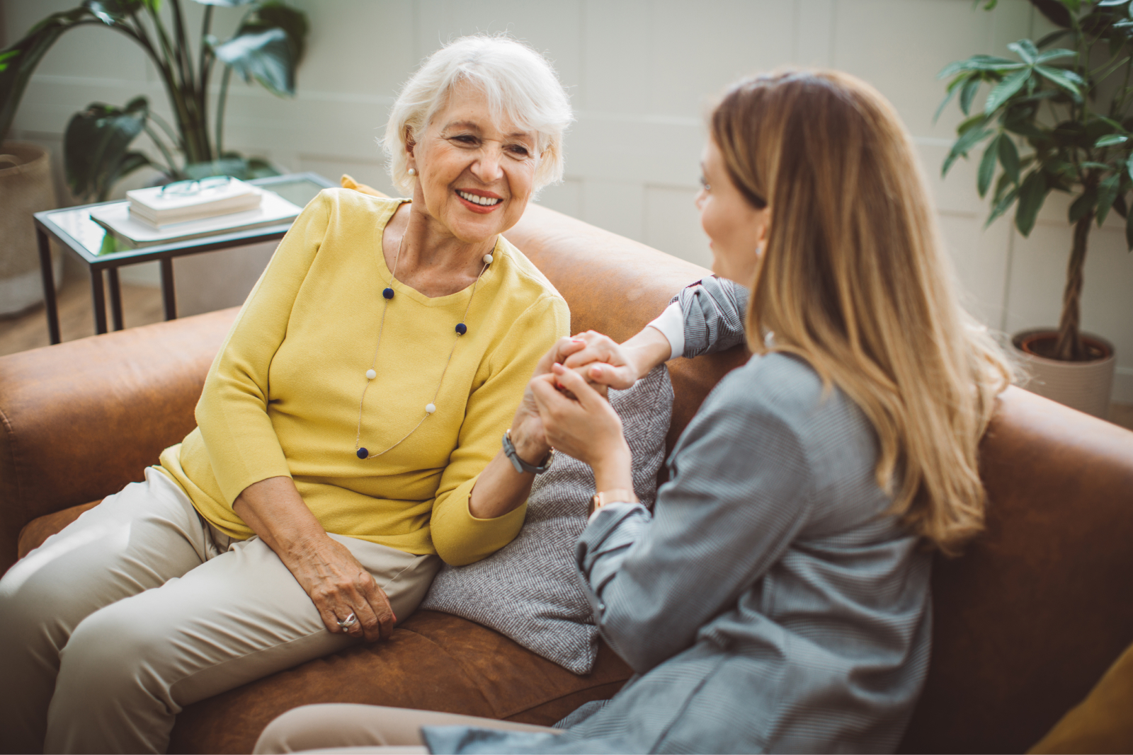 An adult daughter having a conversation with her older mother