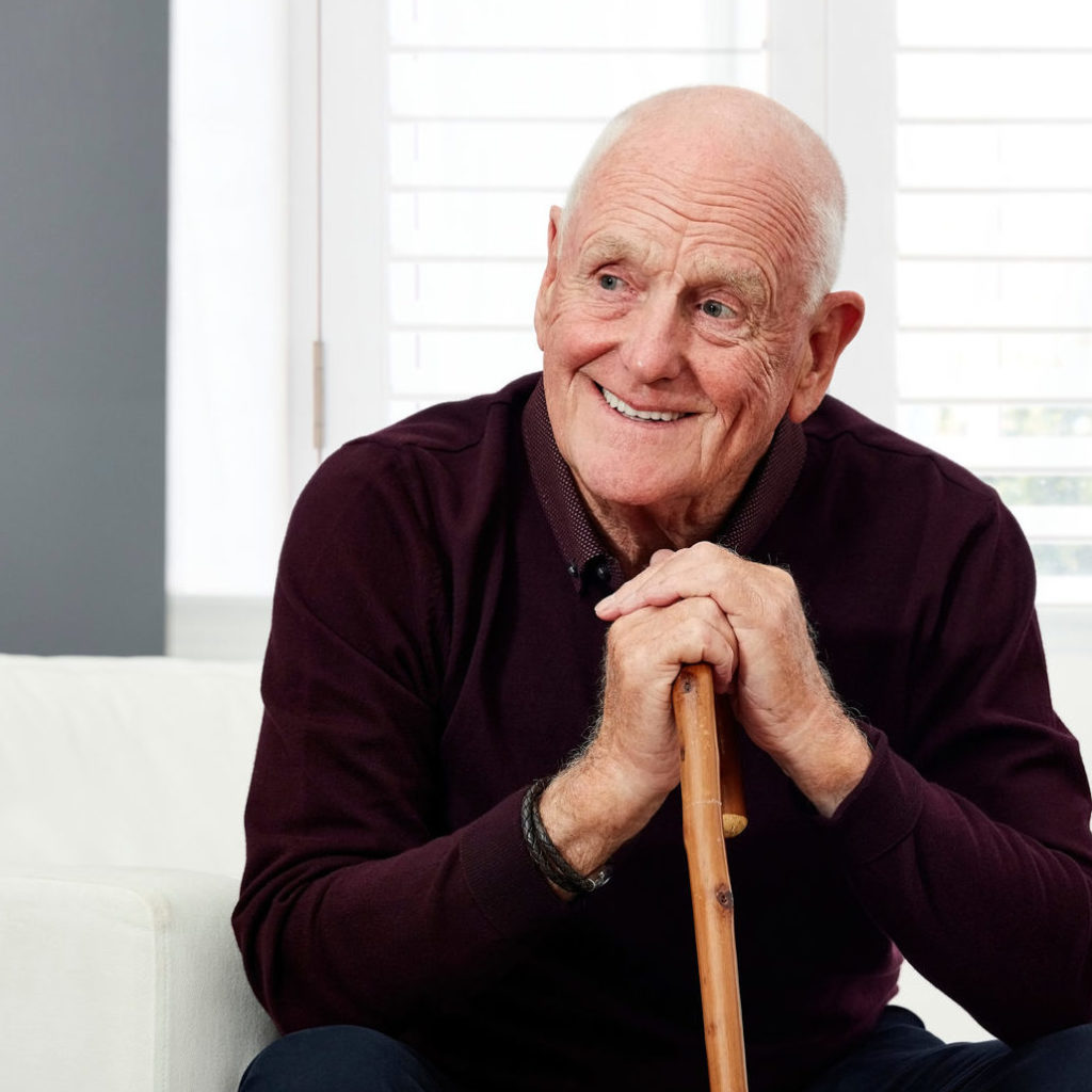 an old person sitting on a couch