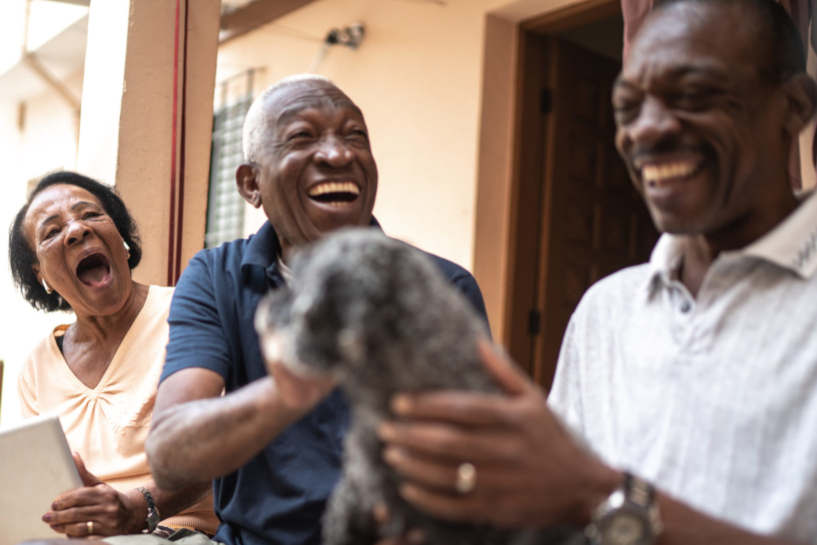 a group of people sitting outside with a dog
