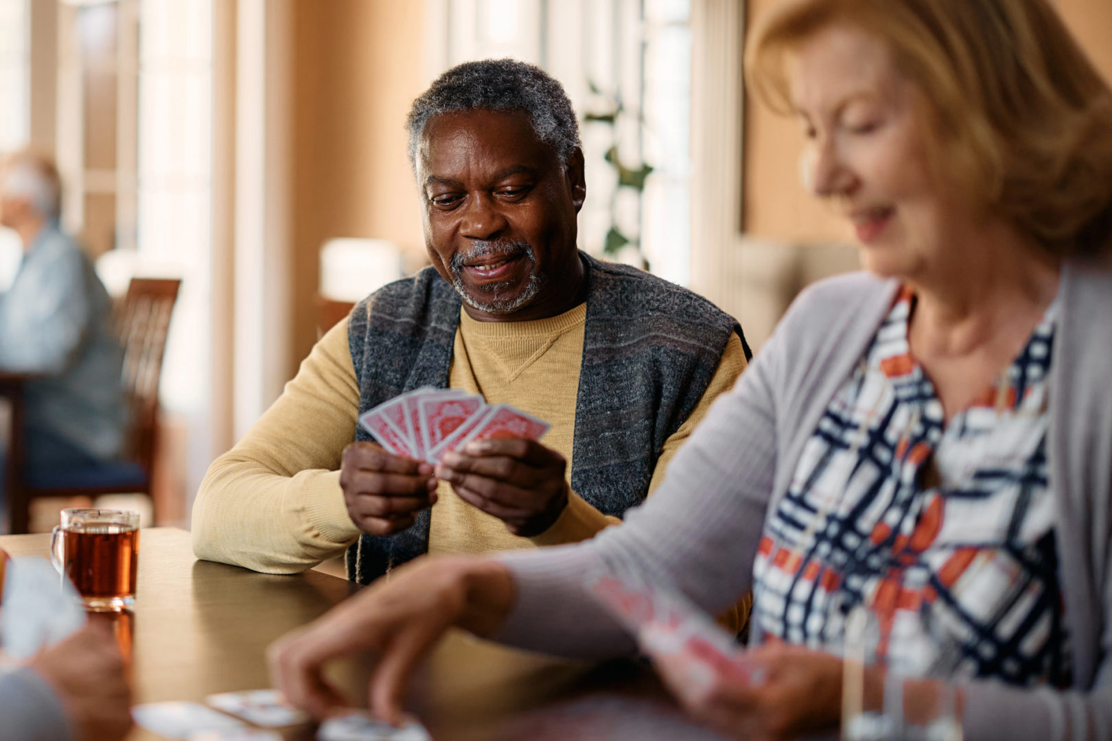 a person and person playing cards