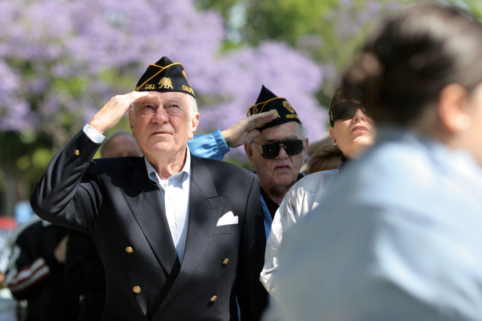 a person saluting with other people