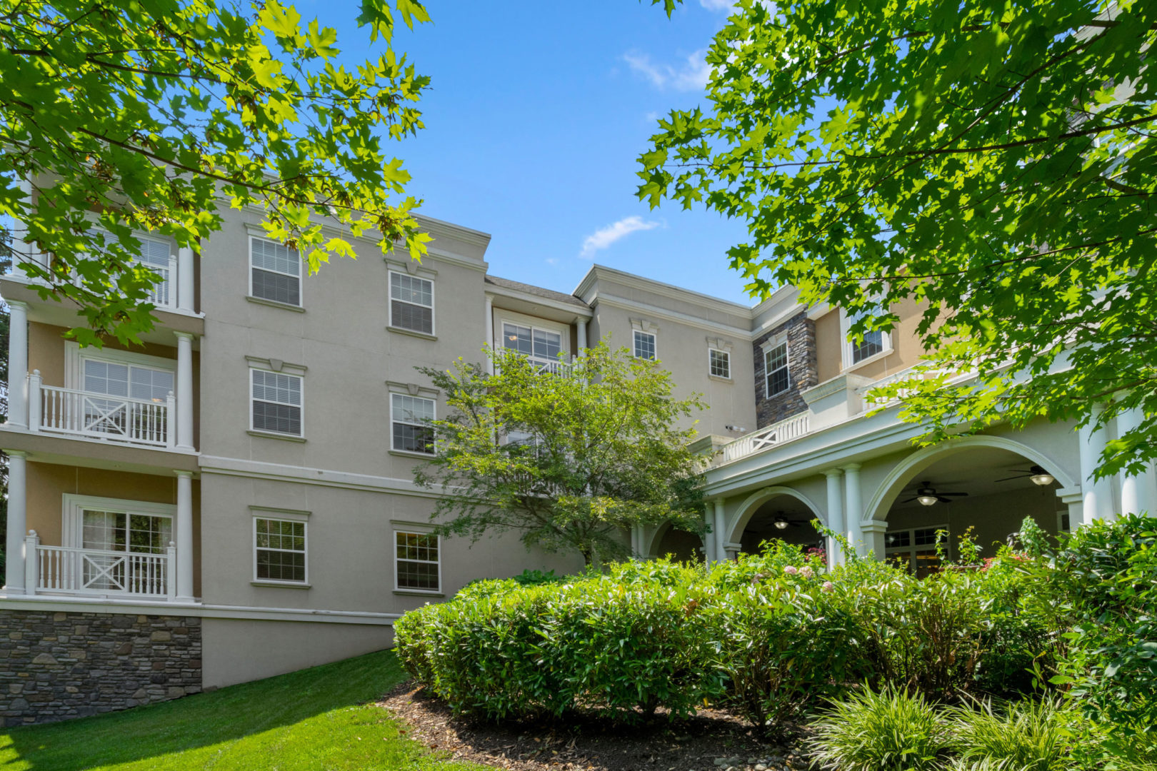 a building with a lawn and trees